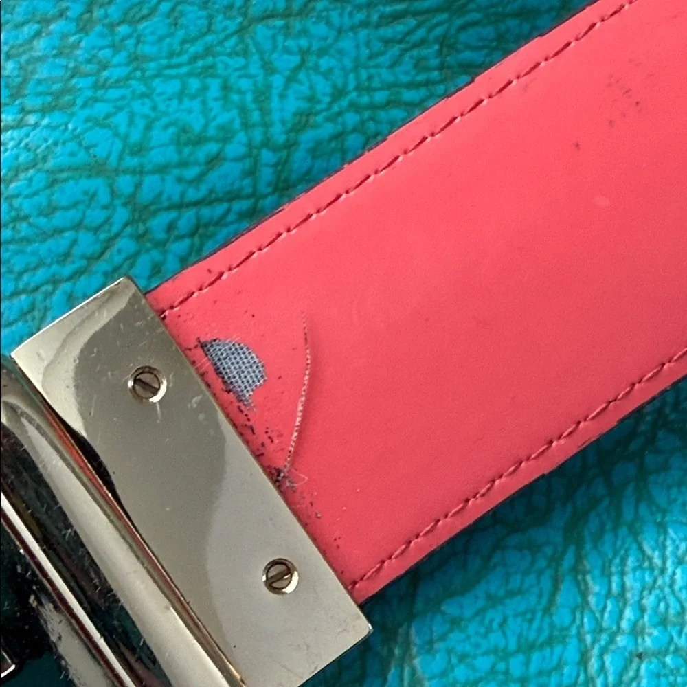 Reversible Michael Kors MK logo belt with bright shiny coral side - see flaw